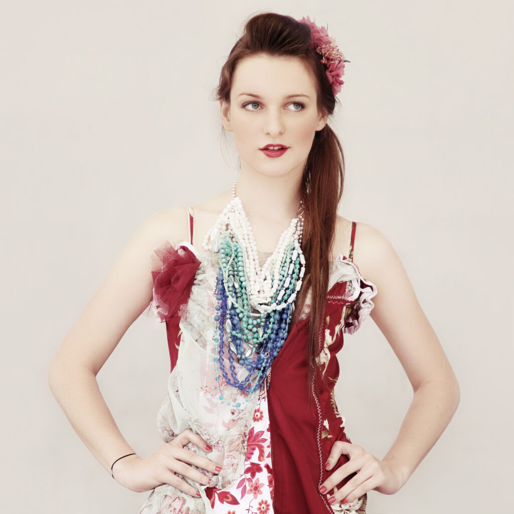 Beau in A Name is a Label dress, Emma Grace necklace and Dames and Divas hairclips