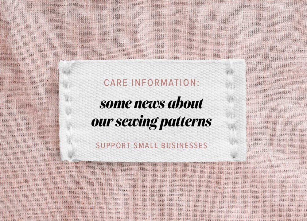 Clothing label says handmade on beige linen background