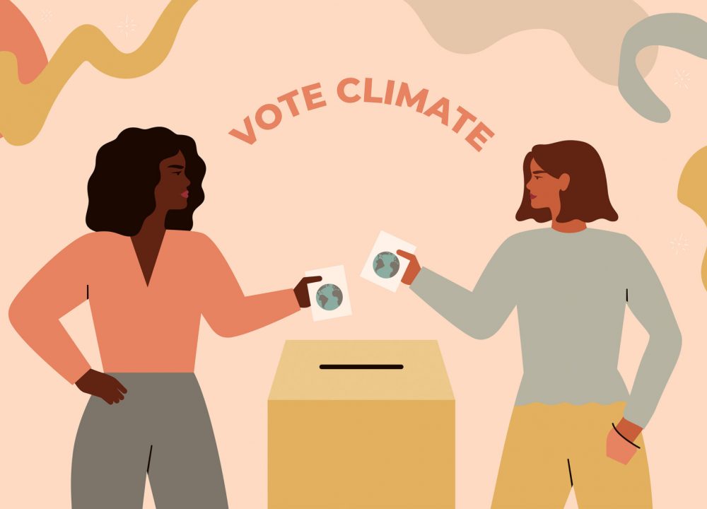 two women vote with ballots in their hands [edit]